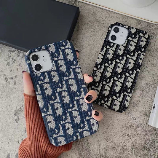 Casing iPhone berbahan kain bordir merek fashion