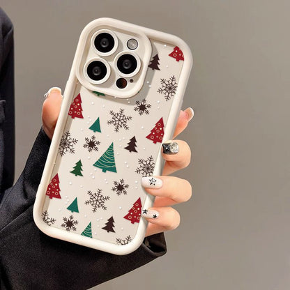 Casing ponsel Apple dengan motif pohon Natal dan kepingan salju