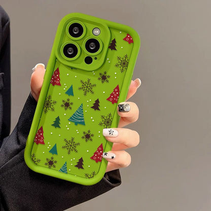 Casing ponsel Apple dengan motif pohon Natal dan kepingan salju
