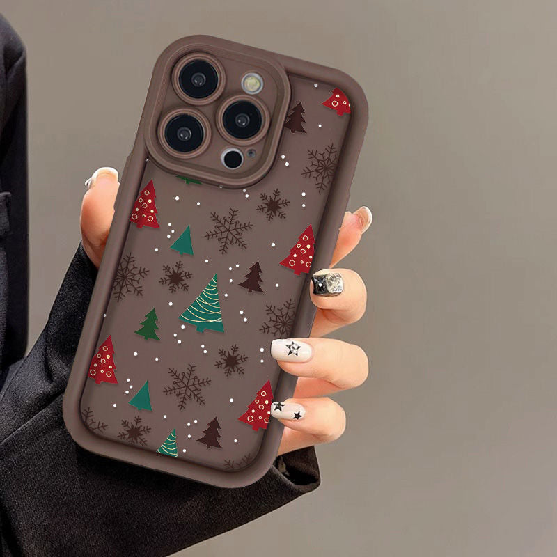 Casing ponsel Apple dengan motif pohon Natal dan kepingan salju